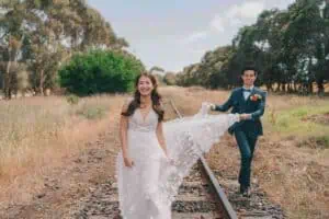 Gee What a Wedding Melbourne wedding planner and celebrant – bride and groom walking along railway tracks at Jack Rabbit Vineyard Bellarine Peninsula