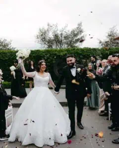 Melbourne marriage celebrant wedding ceremony exit at Meadowbank with bride and groom walking through guests