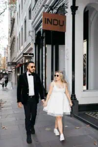 Melbourne wedding planner stylish bride and groom walking in Melbourne city before wedding at Port Melbourne Yacht Club