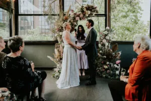 Melbourne marriage celebrant Gee from Gee What a Wedding officiating an intimate rooftop wedding ceremony on New Year’s Eve