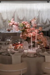 Luxury wedding reception table with blush pink floral centrepiece and candlelight at Carousel Albert Park Melbourne – Gee What a Wedding