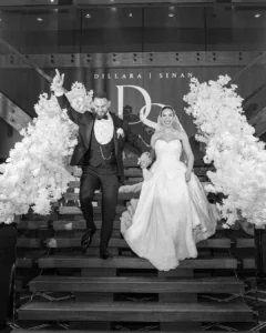 Bride and groom making a dramatic grand entrance with fire effects at Lakeside Banquet and Convention Centre Taylors Lakes – Gee What a Wedding